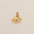 Detailed macro view of a gold-plated Saturn planet pendant featuring a sparkling clear zircon - Planet Pendant