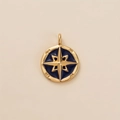 Detail of gold compass pendant with blue enamel and engraved nautical directions - Octagram Eight-Pointed Star Pendant