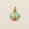 Detailed macro of a shell-shaped gold pendant with colorful enamel and inlaid gemstones - Multicolored Scallop Pendant