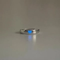Detail view of silver heart ring with glowing blue luminous effect in the dark - Adjustable Open / Heart / Blue