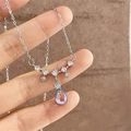 Elegant silver teardrop moonstone pendant necklace with shimmering zircon gemstones - White K