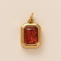 Detailed macro view of a vintage rectangular red gemstone pendant in a gold-plated setting - Red Square Pendant