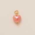 Detail of pink pearlescent heart pendant with elegant golden metal ring attachment - Pearlescent Pink Simple Heart Charm