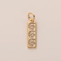 Detailed close-up of 18K gold rectangular pendant with spiral diamond-set patterns - Number 6 Pendant