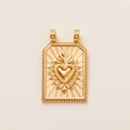 Close-up of golden vintage tarot heart pendant with sunburst texture and beaded edges - Gold Sacred Heart