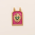 Detail of vintage tarot-style pendant with green heart and red enamel ray texture - Pink Sacred Heart