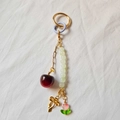 Detail of colorful charm keychain featuring red cherry, green beads and tulip flower pendant - Cherry Bow White Bead Bag Chain