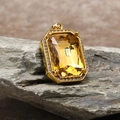 Macro detail of rectangle yellow gemstone pendant with zirconia border on rock - Pendant Only (Without Chain) / Gold Bright Yellow (HT-4146)