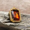 Detail of amber gemstone pendant with gold claw setting and pavé zircon border - Pendant Only (Without Chain) / Gold Red (HT-4146)