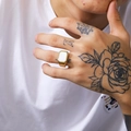 Detailed view of a gold square titanium ring with a white shell inlay on a model hand - Size 7 / Gold White Shell