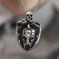 Macro detail of retro stainless steel shield pendant with skull and Spartan helmet carving - Pendant Only (No Chain)