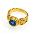 Detailed macro view of gold Celtic knot patterns and round blue gemstone on steel ring - Size 7 / Gold (Blue Rhinestone)