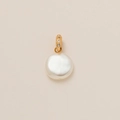 Detailed macro view of a coin-shaped white pearl pendant with a gold diamond-set clasp - Faux Pearl Pendant