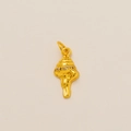Detailed view of a golden conch pendant with sparkling white cubic zirconia stones - Conch