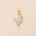 Macro detail of a gold sunburst pendant with iridescent opal inlay on a pink backdrop - Pentagon Opal Look Pendant