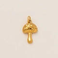 Macro shot of 18K gold-plated mushroom pendant with embossed dots and polished finish - Mushroom Pendant