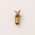 Macro detail of a vintage 18K gold windmill pendant with silver textured blades - Windmill House Pendant