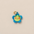 Detailed view of a blue flower pendant charm with a cute face and golden ring - Blue Flower Pendant