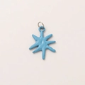 Close-up of sky blue octagonal star pendant with 18K gold plated metal ring - Blue Star Pendant