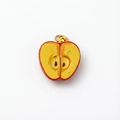 Detailed view of apple-shaped enamel pendant with realistic core and gold ring - Apple Shape Pendant