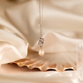 Collier nœud d'amour argenté avec pendentif perle naturelle et finition polie - Collier Torsadé Argenté