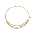 Detail of multilayer gold body chain featuring floral metal plate and lobster clasp - Gold