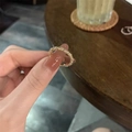 Close-up of golden woven texture ring with delicate granular finish worn on a finger - Gypsophila Ring (JZ050) / Gold