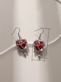 Detailed view of punk style red resin heart earrings with molten silver metal frame - Molten Lava Heart Earrings (Red)
