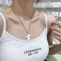 Y2K punk style pink cross pendant necklace with silver chain on a female model - Necklace / White