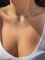 Close-up of layered silver Y-necklace with delicate chain fringe on female model - Double Layer White K 4