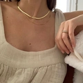 Close-up of layered gold snake chain necklaces and a sparkling diamond-set ring on finger - Gold Snake Chain Pave Ring Layered Set (XL1080-14)