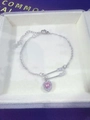 Detail of silver safety pin necklace with pink heart gemstone in a white jewelry box - Paperclip Bracelet (Pink Stone)