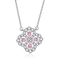 Macro detail of a four-leaf clover necklace with pink teardrop stones and micro-pave crystals - Pink Four Leaf Clover Necklace