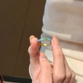 Macro detail of gold marquise cut green gemstone ring with light blue enamel finish - Blue Marquise (JZ257)