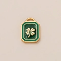 Macro detail of 18K gold plated clover pendant with green enamel inlay for jewelry making - Square Four-leaf Clover Pendant