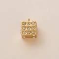 Macro shot of 18K gold plated dice pendant with sparkling white rhinestone embellishments - Dice Pendant