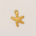 Close-up of golden starfish pendant with granular texture and vacuum plated 18K gold finish - Starfish