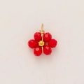 Detailed macro of a handmade 18K gold-plated flower pendant with red crystal faceted beads - Red Flower