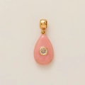 Macro shot of pink drop pendant with central cubic zirconia and gold polished bail - Pink