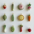 Detail showing 12 miniature vegetable pendants with polished gold-plated metal loops - Strawberry Pendant Only (Without Chain)