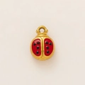 Macro detail of a 18k gold-plated ladybug pendant with red and black enamel finish - Ladybug Pendant