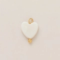 Close-up of heart-shaped shell pendant with 18k gold plated bail and small bead - White Heart Pendant