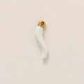 Detail of a curved white ceramic Italian horn pendant with a 18k gold-plated ring attachment - Italian Horn Pendant (Cornicello)
