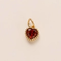 Elegant heart-shaped gold pendant featuring a deep red gemstone and beaded edge details - Heart Pendant
