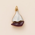 Detail view of a vintage metal sailboat charm with white and burgundy enamel inlay - Sailing Boat Pendant