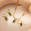 Detail view of vintage gold titanium steel jewelry set with emerald green gemstones - Emerald Green Rectangle Collection