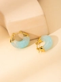 Detail view of C-shaped earrings in light blue marbled resin with 18K gold plated metal - C-shaped Ear Buckle (#2 Blue)