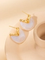 Close-up of golden irregular earrings with pearlescent white resin pendant on beige background - Irregular Patchwork Studs (#3 White)