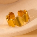 Detailed close-up of golden adjustable ring with connected circular disc elements - Round Plate Style (27) / Gold
