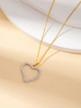 Close-up of heart-shaped pendant with pavé crystals on a delicate gold chain necklace - 18K Gold / Heart #1